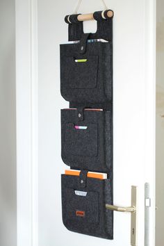 three pockets are hanging on the wall