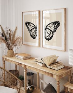 there are two framed butterflies on the wall