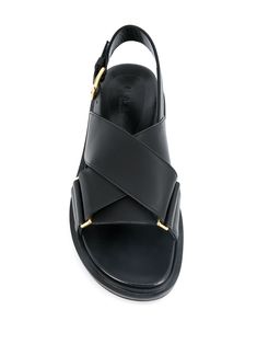 Has a new pair of sandals (criss) crossed your mind? With these black leather cross-over strap sandals from Marni, your feet will feel snug within their leather straps and comfy flat rubber sole. Cross your heart and hope to buy. Featuring an open toe, a flat rubber sole, crossover straps to the front and a buckle fastening. | Marni Cross-Strap Sandals Marni Slippers, Stylish Black Women, Designer Baby, Designer Sandals, Beautiful Shoes, Sock Shoes