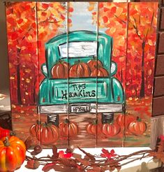 a painting of a truck with pumpkins on it