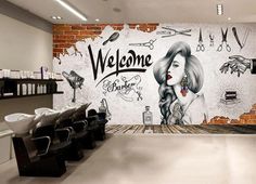 a hair salon with a brick wall and mural