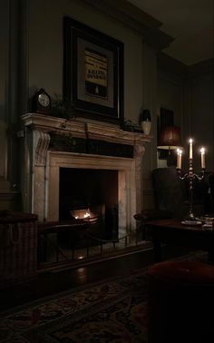 a living room with a fire place and two candles