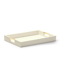 a white tray with gold handles