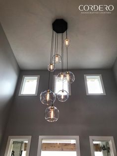 a chandelier hanging from the ceiling in a room