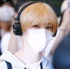 a man with headphones and a mask on