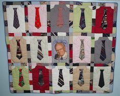 a quilted wall hanging with ties and a photo of a man's face