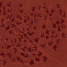 an image of a plant that is on the wall with red paint and brown paper