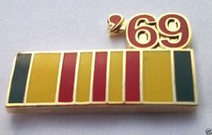 a pin with the number 69 on it