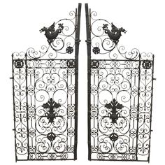 two wrought iron gates with horses on them