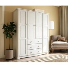 a large white armoire in a living room