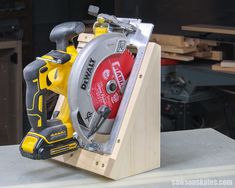 a cordless circular saw in a wooden holder