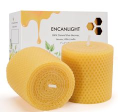 two beeswap candles are next to each other in front of a box that says encanlight