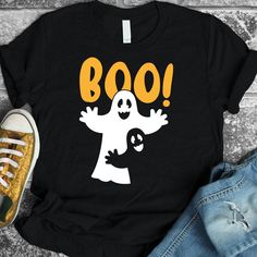 a t - shirt that says boo with a ghost on it