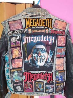 the back of a jacket that has been decorated with images and words from megadeth