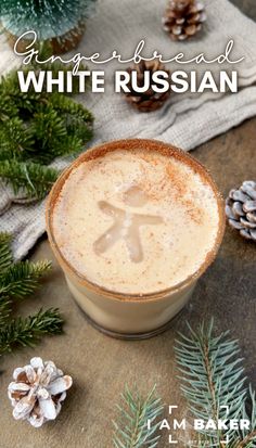 a white russian drink in a glass with pine cones on the side and snow flakes around it