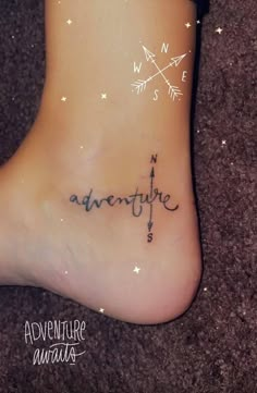 a person with a tattoo on their foot that says adventure and an arrow is written in cursive writing