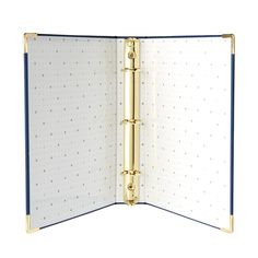 an open binder with blue trim and gold hardware on the front, inside view