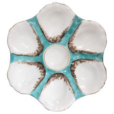 a blue and white plate with brown designs on the rim, isolated against a white background