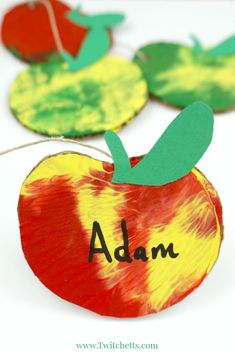 paper plate apple craft for kids to make with the letters adam and an apple on it