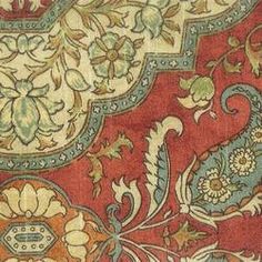 an ornate red and blue design on fabric