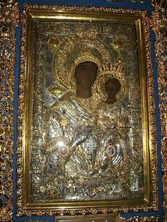 an ornate gold and blue wall hanging in a room