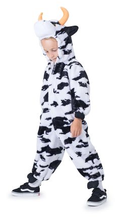 a little boy in a costume that is wearing a cow suit and has horns on his head