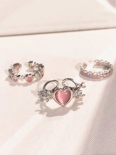 𝔇𝔢𝔱𝔞𝔦𝔩𝔰 Style: Y2k, Coquette, Kawaii Materials: Rhinestone Quantity: 3 pcs(set) This exquisite set features adorable heart-shaped stones that are bound to steal your heart! The rings are shinning and give off a delightful glimmer, adding a touch of sparkle to any outfit. Enjoy free shipping with a purchase of over 80$ Trio Rings, Kawaii Ring, Rhinestone Rings, Y2k Coquette, Trio Ring, Heart Rhinestone, Coquette Pink, Open Arms, Rhinestone Ring