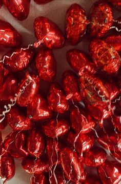 red foiled heart shaped chocolates in a bag