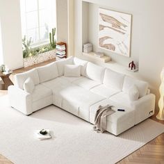 a living room with a large white sectional couch