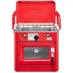 a red stove top oven with two burners and one door open to the side