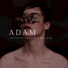 a man with butterfly wings on his face and the words adam above him are in white