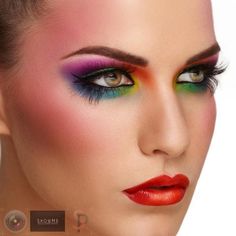 This powerful makeup features a beautiful combination of colorful eyeshadow tones. It is further matched with bright red lipstick and a powerfully bright blush. DIY with the how-to here. Eye Makeup Red, Orange Eye Makeup, Beauty Portraits, Bright Eye Makeup, Red Lipstick Makeup, Bright Makeup, Eyes Lips Face