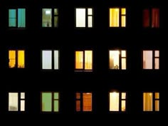 many windows are lit up at night in the dark