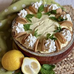 there is a pie on the table with lemons