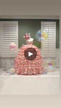 a cake made out of balloons on top of a table