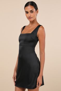 Everyone will want to dote on you when you strut through the room in the Lulus Truly the Cutest Black Satin Square Neck Mini Dress! Luxe woven satin shapes this sweet little dress with a classic square neckline, a darted bodice, and tank straps. Empire-style waist sits atop a figure-skimming A-line skirt that ends at a flirty mini hem. Hidden side zipper/clasp. Pair with your favorite stiletto heels for a chic look! Fit: This garment fits true to size. Length: Mid-thigh. Size medium Bust: Works Black Dresses Cocktail, Black Mini Formal Dress, Simple Hoco Dresses, Short Black Dress Outfit, Black Formal Dress Short, Movie Core, Black Hoco Dresses, Little Black Dress Cocktail, Satin Skater Dress