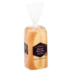 a loaf of bread wrapped in plastic on a white background with a black label that says,