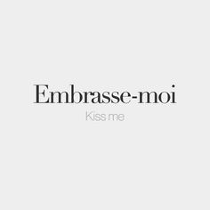 the words embrace - moi kiss me are in black and white, against a light gray background