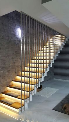 the stairs are lit up with leds to illuminate light in this modern home