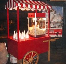 an old fashioned popcorn cart is on display