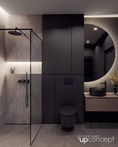 a modern bathroom with black and white walls, a round mirror over the toilet and a walk - in shower