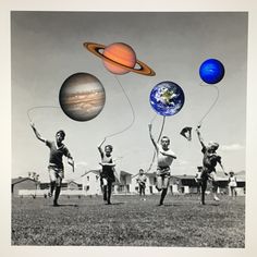 an old black and white photo of people flying kites in front of the solar system