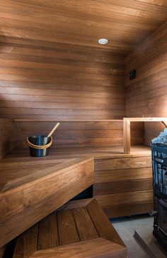 the inside of a sauna with wooden walls and benches