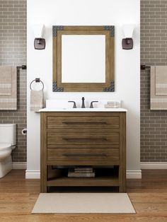 a bathroom with a sink, mirror and toilet