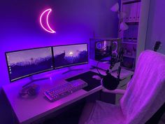 a computer desk with two monitors, keyboard and mouse in front of a purple light