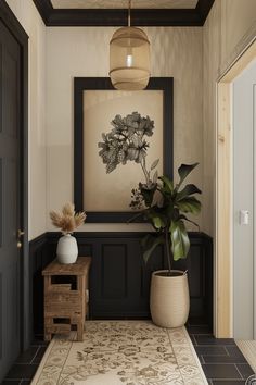 a large plant in a vase on the floor next to a wall with a painting