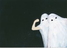 two white angel figurines standing next to each other in front of a black background