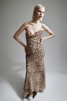 A bolder sense of expression. The Monroe Cowl Neck Maxi Dress features a statement maxi design in an allover leopard print. Fitting to the form, it has a cow neckline, slim adjustable straps and a flared hem.SIZING: True to size. AU: Model wears a size 8 / US: Model wears a size 4.FABRICATION: Main: 100% polyester. Lining: 100% polyester - Bias cut - Cowl neckline - Adjustable straps Cow Print Slip Dress, Chic Leopard Print Party Maxi Dress, Rat And Boa Leopard Dress, Cow Print Dress, Corsets Fashion, Cowl Neck Maxi Dress, Mum Jeans, Maxi Design, Chic Leopard Print V-neck Midi Dress