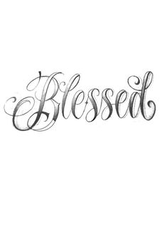 the word blessed written in cursive writing