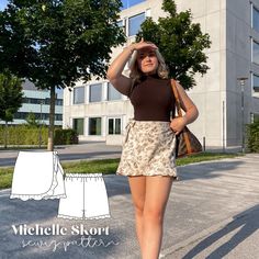 a woman is walking down the street with her hand on her head while wearing a skirt